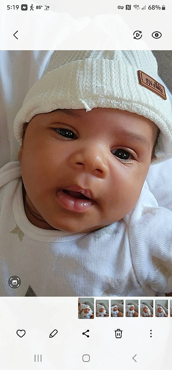 Angelo is registered to the contest to win money with this photo: baby, baby_toddler_clothing, cap, cheek, child, costume_hat, eyelash, fashion_accessory, fun, happy, hat, headwear, helmet, lip, nose, outerwear, person, skin, smile, sun_hat