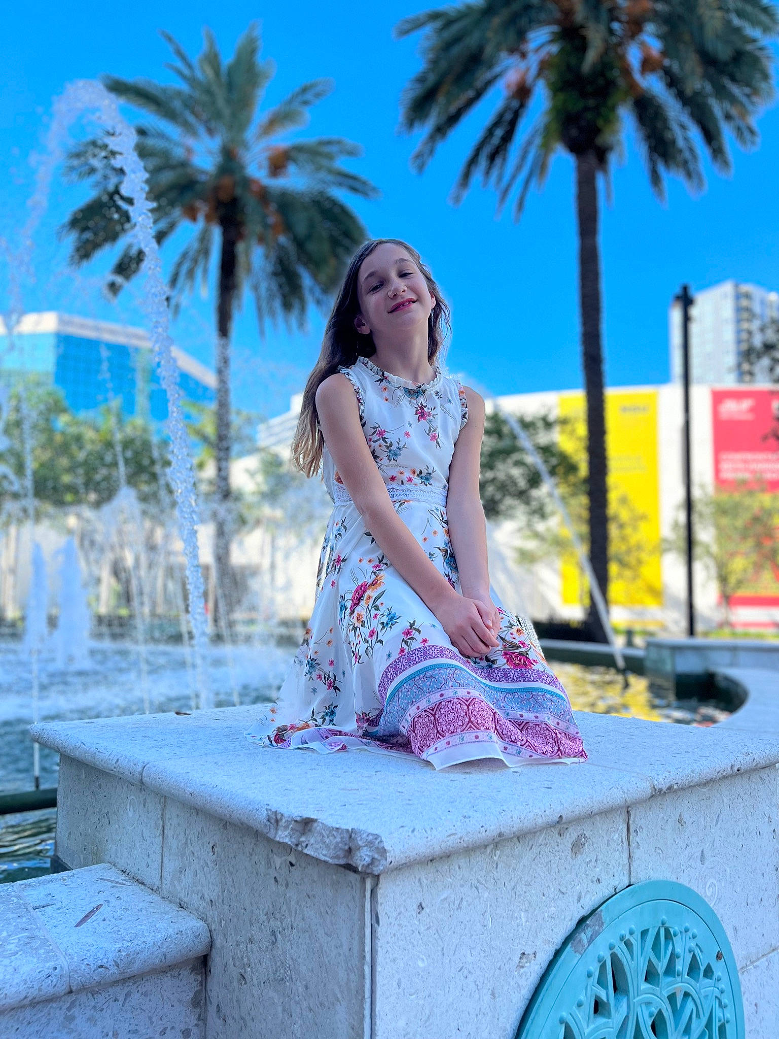 Sophia is registered to the contest to win money with this photo: arecales, azure, blue, dress, eyewear, fashion_design, flash_photography, footwear, happy, joy, leisure, light, magenta, person, photograph, plant, shoe, sky, summer, thigh