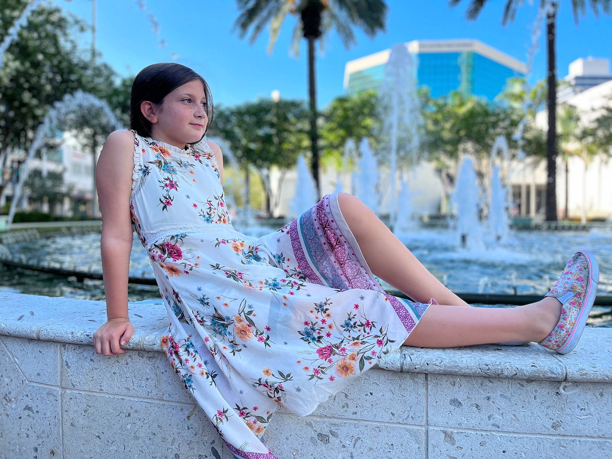 Molly is registered to the contest to win money with this photo: arecales, azure, black_hair, day_dress, dress, flash_photography, grass, human_leg, knee, leisure, palm_tree, pattern, person, plant, sky, sleeve, summer, thigh, travel, tree