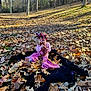 Hannah is registered to the contest to win money with this photo: clothing, costume, dress, face, grass, grove, head, land, leaf, nature, outdoors, park, person, photography, plant, portrait, tree, vegetation, wilderness, woodland