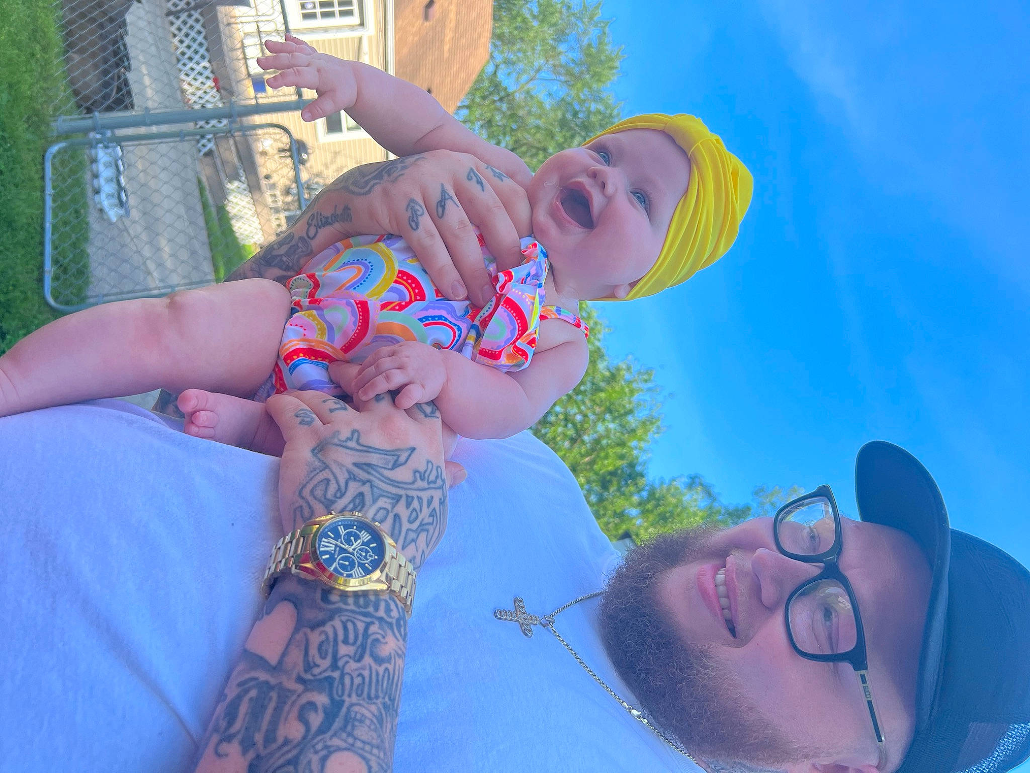 Ensley is registered to the contest to win money with this photo: arm, beauty, blue, cool, electric_blue, eyewear, finger, fun, gesture, grass, happy, hat, headwear, leisure, muscle, people_in_nature, person, recreation, sky, smile