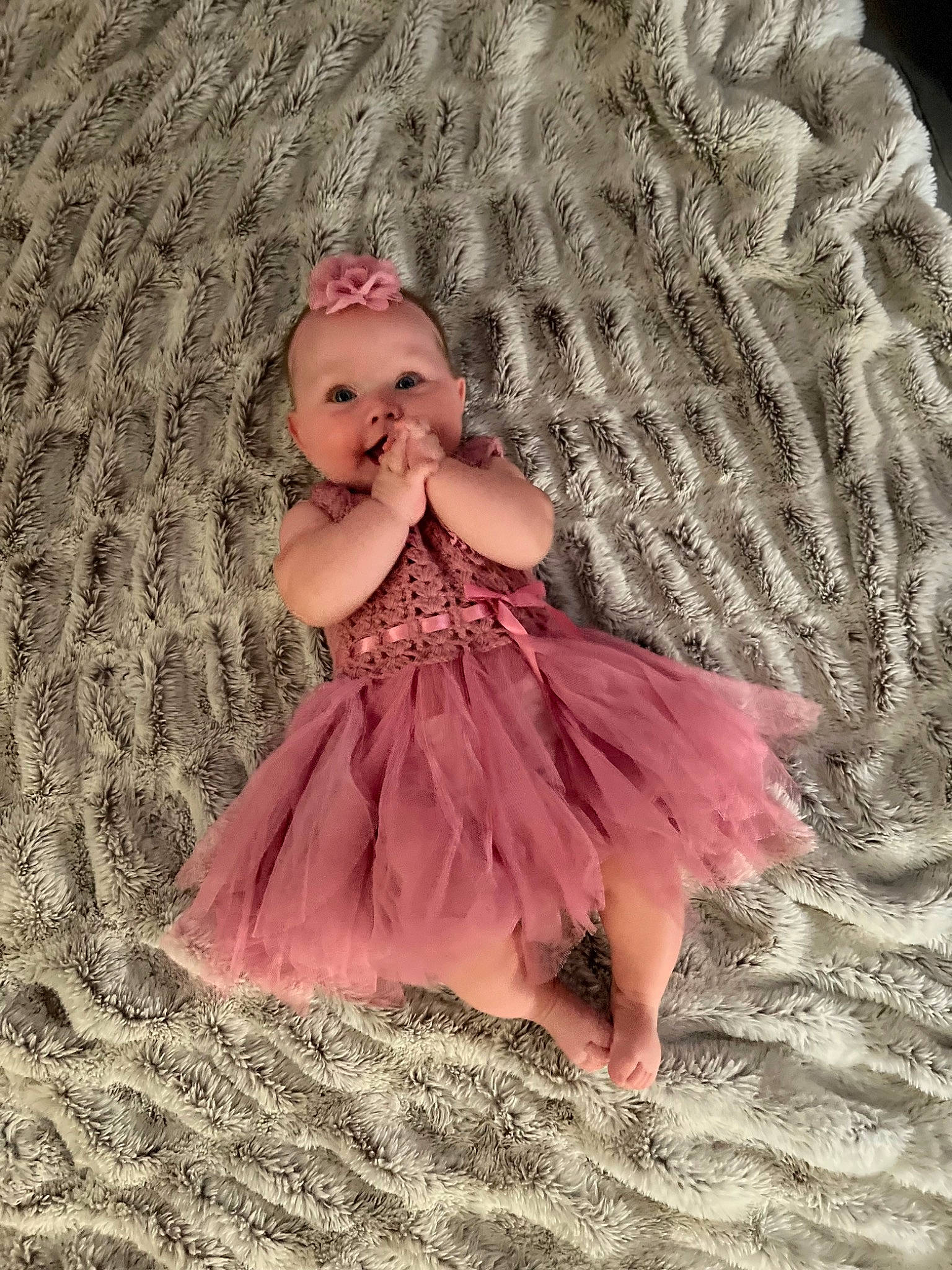 Ensley is registered to the contest to win money with this photo: baby_toddler_clothing, blond, bridal_accessory, child, costume, day_dress, dress, embellishment, fashion_accessory, fashion_design, happy, headpiece, magenta, one_piece_garment, pattern, peach, person, pink, ruffle, sleeve