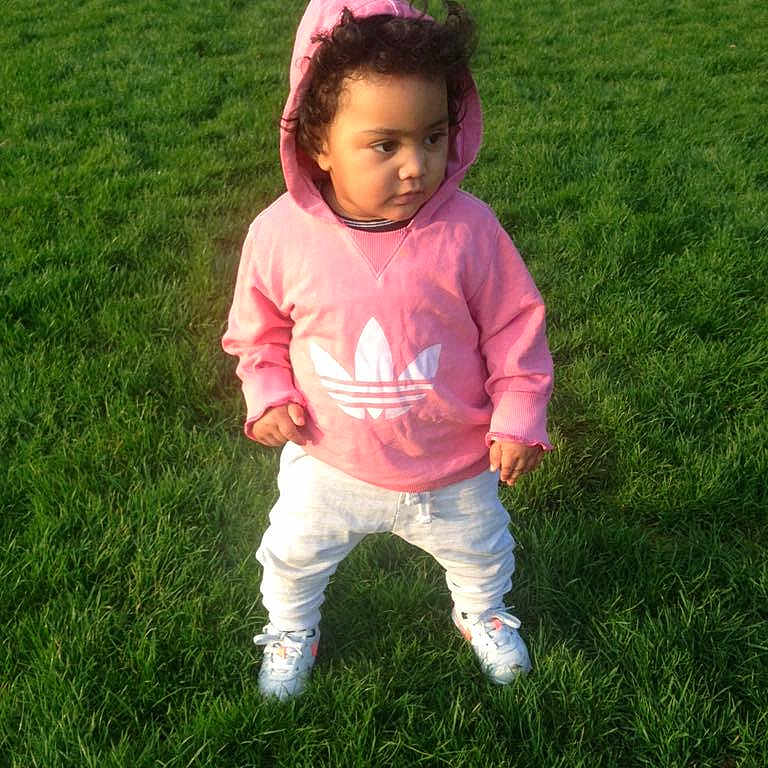 Bernardo is registered to the contest to win money with this photo: child, day, fun, girl, grass, green, infant, lawn, meadow, person, pink, plant, play, skin, smile, spring, standing, summer, toddler