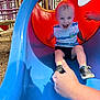 Colin joined the competition — help win amazing prizes! child, toddler, slide, playground, outdoor, happy, smile, blue, red, yellow, clothing, shoes, hand, fun, summer, daylight, recreation, park, person, excited
