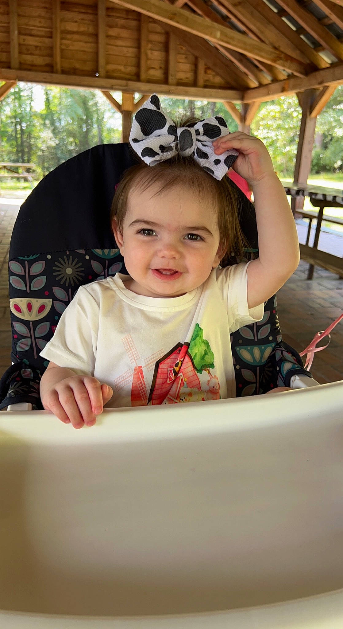 Madilynn is registered to the contest to win money with this photo: auto_part, baby, baby_toddler_clothing, chair, child, eyewear, fashion_accessory, finger, fun, happy, helmet, joy, leisure, person, personal_protective_equipment, plant, recreation, sitting, skin, smile