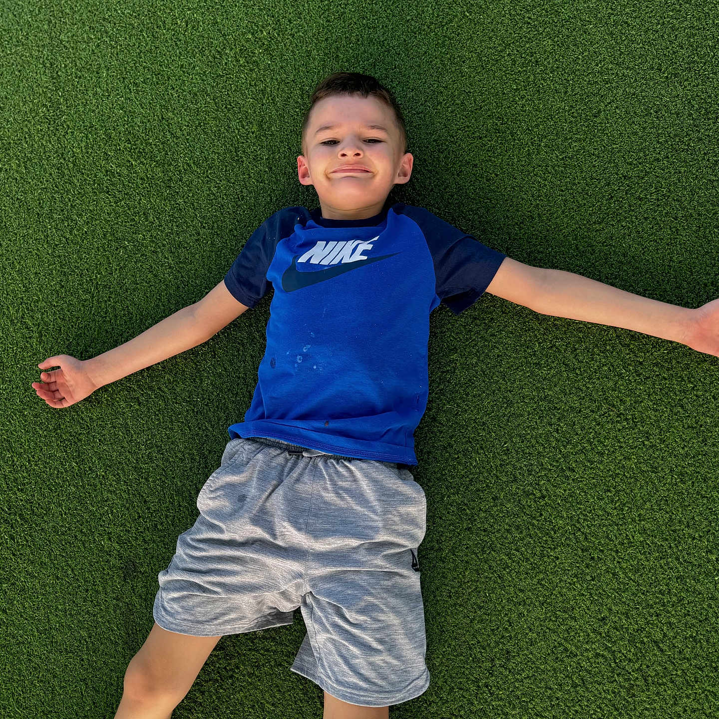 Solomon joined the competition — help win amazing prizes! boy, casual_clothing, child, fun, grass, greenery, happy, leisure, nature, nike_shirt, outdoor, person, playing, posing, recreation, relaxation, shorts, smile, summer, young