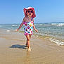 child, beach, ocean, water, sand, sunhat, sunglasses, swimsuit, summer, sunny, walking, waves, shoreline, outdoor, vacation, playful, cute, young, fun, daytime