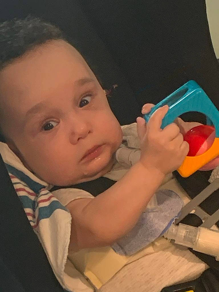 Jorge Jr joined the competition — help win amazing prizes! baby, car_seat, carmine, chair, cheek, child, finger, fun, hairstyle, mouth, nail, nose, person, plastic, sitting, skin, table, tableware, thumb, toddler