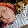 Origami participe au concours pour gagner de l'argent avec cette photo : person, cat, calico_cat, glasses, pink_hair, orange_hair, white_shirt, blanket, indoor, close_up, face, pet, snuggling, resting, affection, cozy, portrait, human, animal, warm_lighting