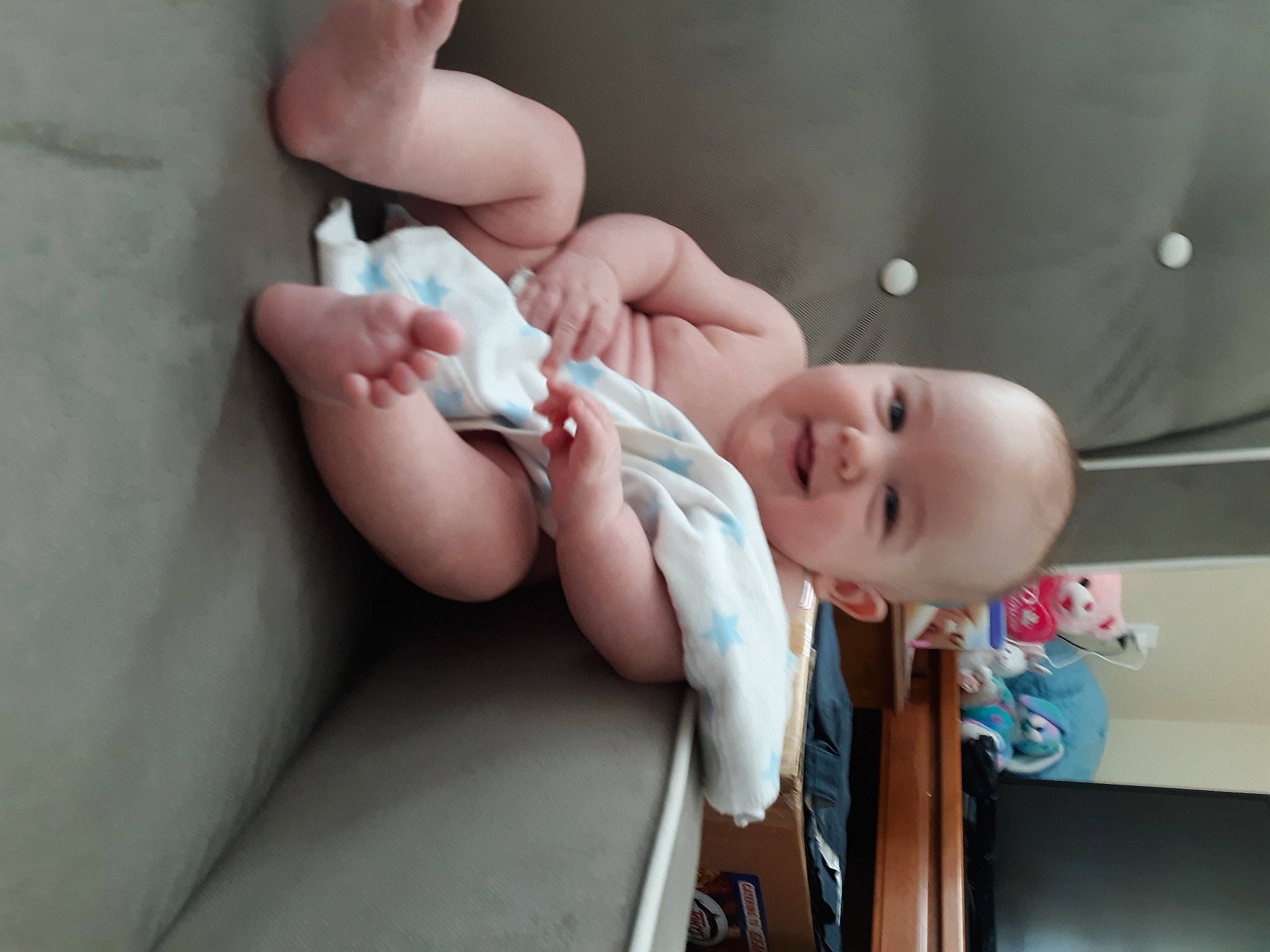 Travis is registered to the contest to win money with this photo: baby, baby_products, baby_toddler_clothing, cheek, child, comfort, finger, foot, gesture, hand, happy, human_body, joy, mouth, nail, nose, person, skin, smile, thumb