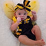 baby, infant, costume, bee, wings, headband, bow, black_and_yellow, legs, arms, blanket, soft, cute, child, portrait, indoors, clothing, person, lying_down, skin