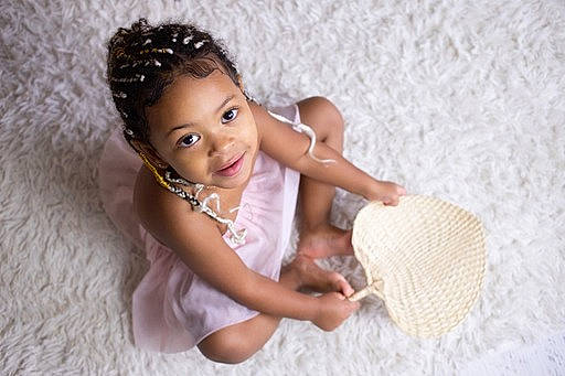 Luna participe au concours pour gagner de l'argent avec cette photo : abdomen, baby, baby_toddler_clothing, child, eyelash, fashion_accessory, flash_photography, fun, happy, headpiece, jewellery, linens, magenta, person, sitting, skin, smile, thigh, toddler, wood