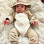 Aiden is registered to the contest to win money with this photo: baby, infant, onesie, hood, antlers, blanket, fluffy, cozy, cute, hands, feet, socks, beige, white, soft, lying_down, portrait, child, young, comfortable