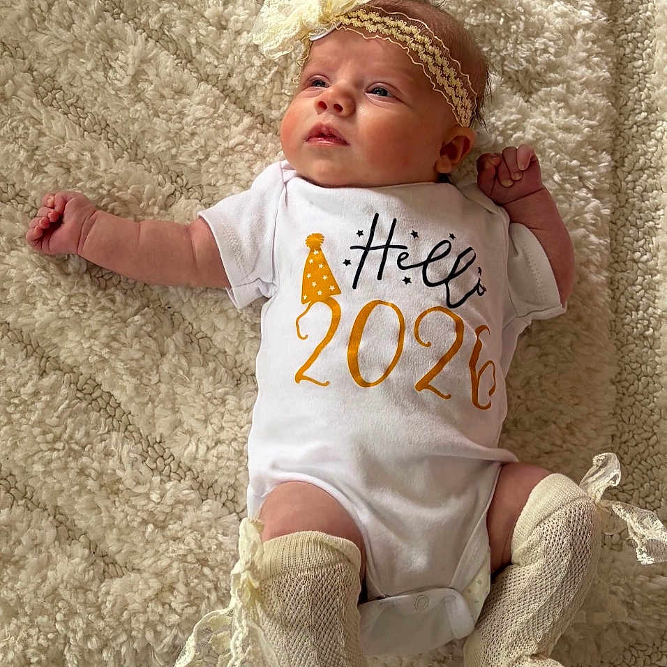 Nirvana joined the competition — help win amazing prizes! baby, blanket, bow, celebration, child, clothing, curious, cute, fluffy, headband, indoors, infant, lace, lying_down, new_year, onesie, party_hat, portrait, socks, soft_texture