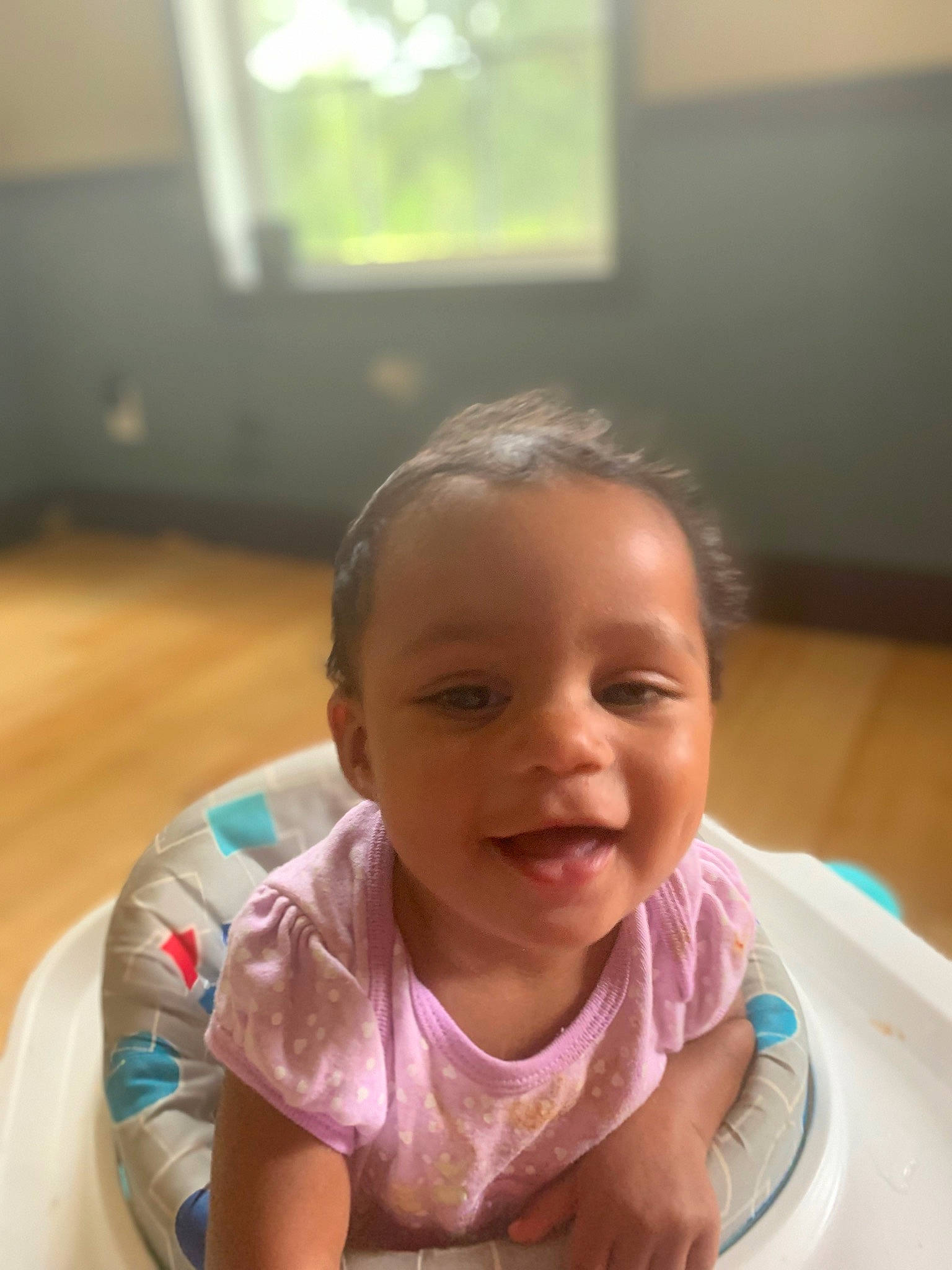 Kathryn is registered to the contest to win money with this photo: baby, baby_toddler_clothing, cheek, child, chin, eyebrow, flooring, fun, happy, iris, lip, mouth, neck, nose, person, skin, sleeve, smile, thumb, toddler