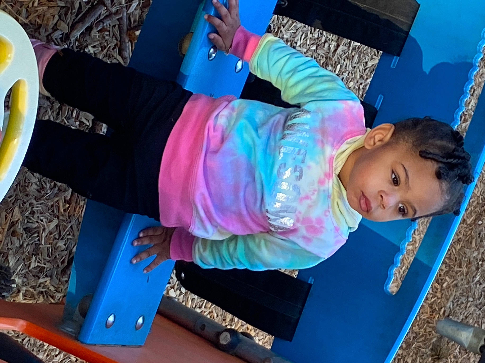 Nami is registered to the contest to win money with this photo: baby_toddler_clothing, blue, child, electric_blue, fun, leisure, magenta, outdoor_play_equipment, people, person, play, recreation, sitting, smile, sneakers, t_shirt, tableware, toddler, vacation, yellow