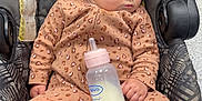 Jazmine joined the competition — help win amazing prizes! baby, sleeping, car_seat, milk_bottle, onesie, infant, child, toddler, clothing, pattern, leopard_print, hand, face, hair, floor, seatbelt, comfort, indoors, peaceful, rest