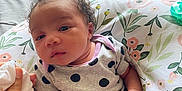 Zenobia is registered to the contest to win money with this photo: baby, bed, bedroom, blanket, clothing, cushion, face, furniture, hair, head, homedecor, indoors, newborn, person, photography, portrait, quilt, room, sitting, sleeve
