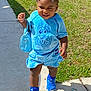toddler, child, blue_outfit, blue_shoes, sidewalk, grass, hair_bows, handbag, determined_expression, sunlight, outdoor, shorts, tshirt, socks, walking, person, young_child, summer_clothing, beads, fashion