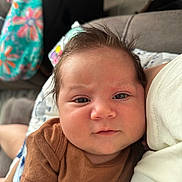 Jaxen joined the competition — help win amazing prizes! baby, blanket, brown_shirt, casual, child, close_up, clothing, comfort, cute, expression, fabric, face, hair, indoors, infant, person, portrait, resting, skin, soft_light