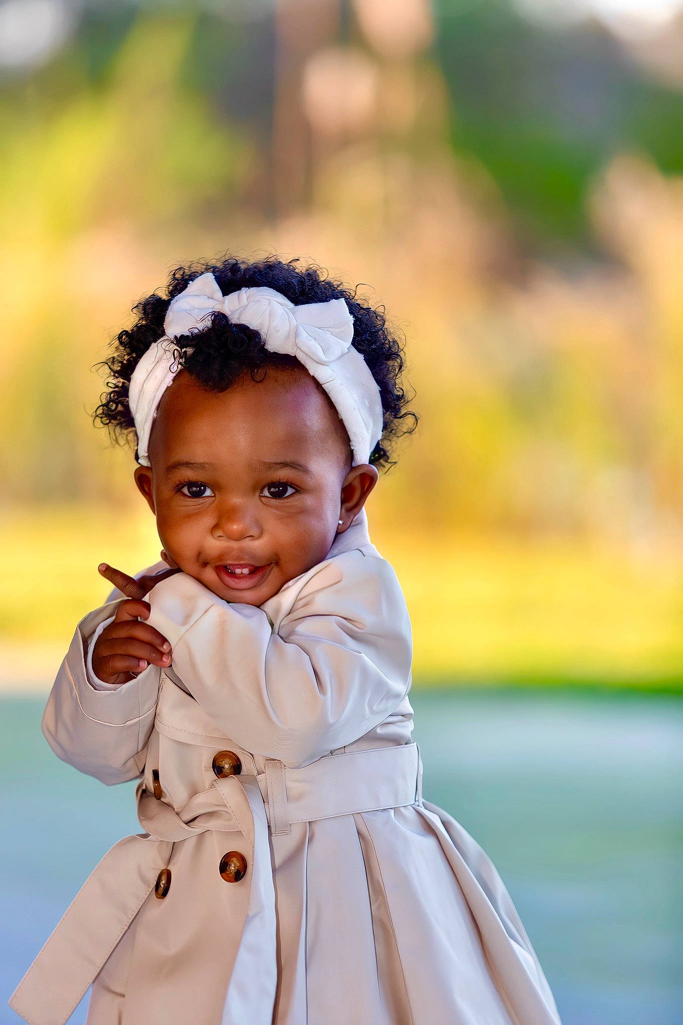 Skylar is registered to the contest to win money with this photo: baby_toddler_clothing, day_dress, dress, eye, flash_photography, grass, hair_accessory, happy, hat, headband, headgear, headpiece, human_body, jewellery, necklace, people_in_nature, person, sleeve, smile, street_fashion