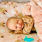 Novaleigh is registered to the contest to win money with this photo: baby, sleeping, blanket, pacifier, cozy, infant, cute, soft, animal_print, pink, leopard_print, newborn, peaceful, child, resting, clothing, indoors, portrait, comfort, toddler