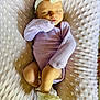 Novaleigh joined the competition — help win amazing prizes! newborn, baby, sleeping, headband, flower, onesie, purple_clothing, blanket, soft_texture, infant, cute, resting, cozy, indoors, closeup, small_feet, baby_mittens, peaceful, portrait, toddler