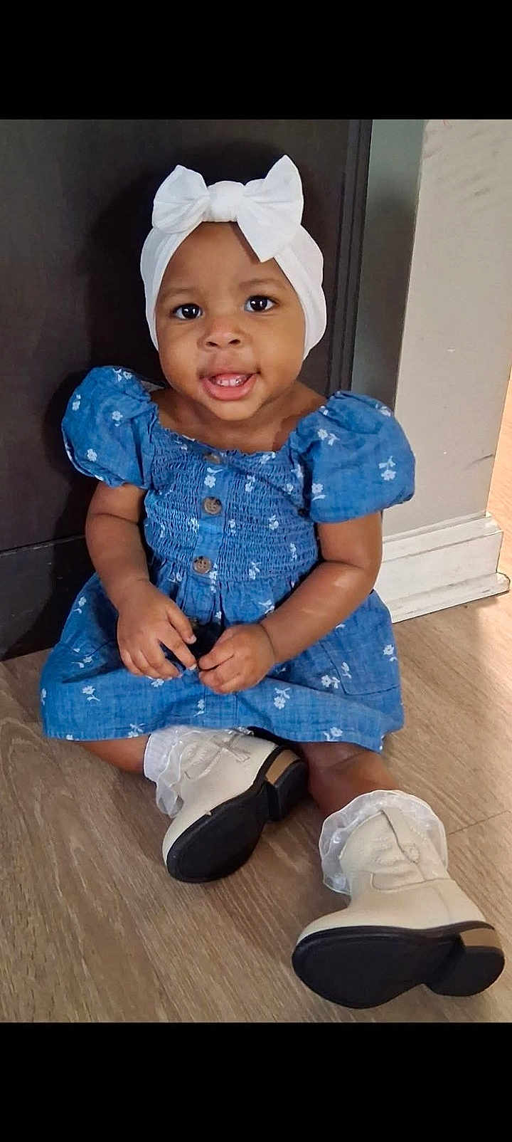Saniyah Heaven joined the competition — help win amazing prizes! toddler, child, baby, blue_dress, head_wrap, bow, white_boots, frilly_socks, floor, indoor, smile, sitting, person, cute, fashion, portrait, young_child, happy, skin, eyes