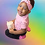 toddler, child, pink_headband, pink_shirt, black_pants, pink_socks, sippy_cup, smiling, sitting, cross_legged, happy, cute, portrait, indoor, colorful_background, headwear, young_child, person, baby, cheerful
