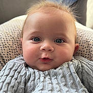 Amaury participe au concours pour gagner de l'argent avec cette photo : baby, blue_eyes, cable_knit, child, closeup, cozy, cute, expression, face, fluffy_hair, gray_clothing, indoors, infant, newborn, person, portrait, skin, soft_light, sweater, warm