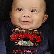 Amaury participe au concours pour gagner de l'argent avec cette photo : baby, smiling, blue_eyes, face, infant, clothing, toddler, portrait, cute, expression, sitting, child, fuzzy_design, superhero, red_mask, navy_shirt, closeup, happy, young_child, indoor