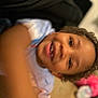 Christopher is registered to the contest to win money with this photo: child, smiling, curly_hair, indoor, motion_blur, toddler, face, arm, colorful, toy, carpet, candid, happy, person, closeup, playful, skin, head, clothing, background