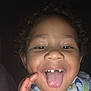 Christopher joined the competition — help win amazing prizes! child, curly_hair, tongue_out, smiling, missing_teeth, close_up, face, hand, scarf, joyful, playful, portrait, indoors, happy, person, skin, mouth, expression, baby, cute