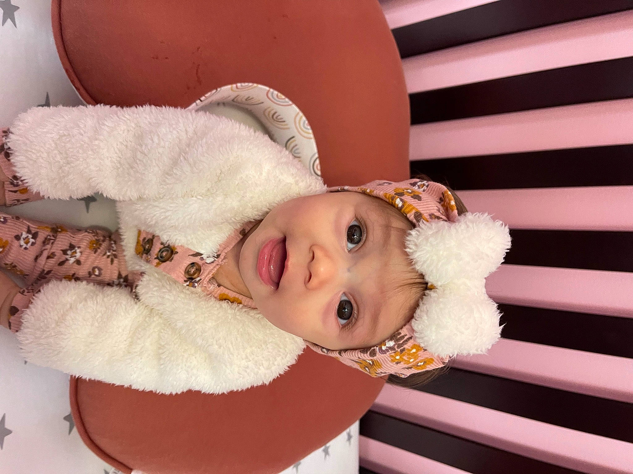 Nova is registered to the contest to win money with this photo: baby, baby_toddler_clothing, cheek, child, eyelash, fashion_accessory, fur, happy, hat, headwear, lip, nose, pattern, person, pink, portrait_photography, sleeve, smile, surprise, toddler