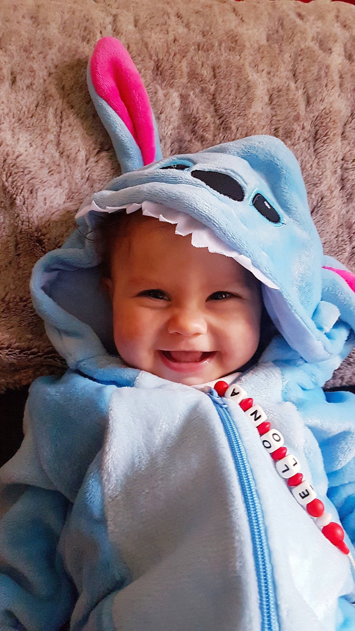 Elona participe au concours pour gagner de l'argent avec cette photo : baby, child, headgear, headwear, joy, person, product, smile, toddler