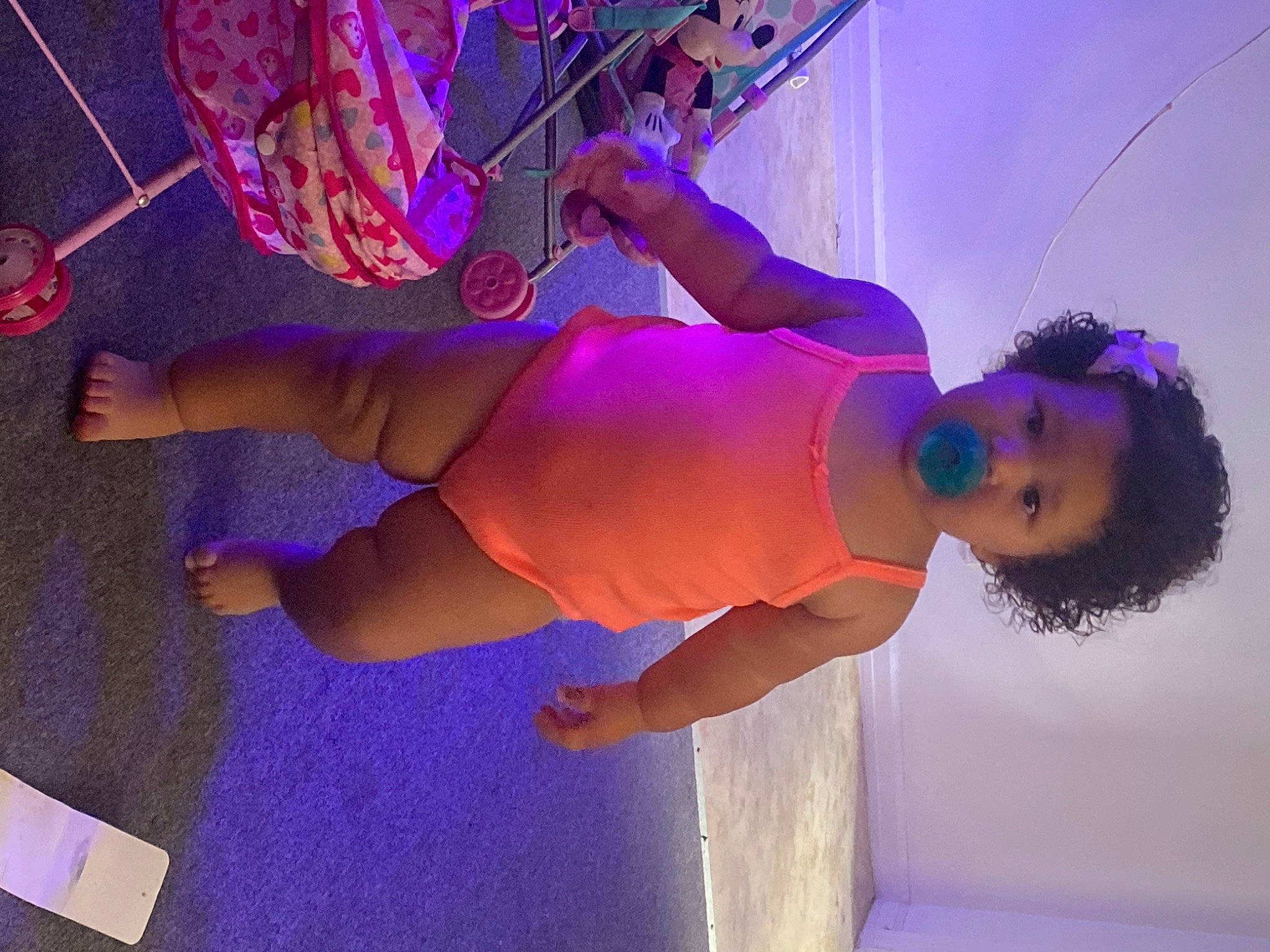 Alyssa is registered to the contest to win money with this photo: elbow, electric_blue, entertainment, event, fun, human_body, human_leg, joint, knee, leg, leisure, magenta, muscle, performing_arts, person, pink, purple, sandal, shorts, thigh