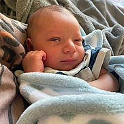 Jahmari is registered to the contest to win money with this photo: newborn, baby, blanket, sleepy, closeup, face, infant, cozy, soft, child, wrapped, comfort, cute, resting, skin, hand, portrait, indoors, warm, young