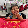 baby, child, toddler, restaurant, high_chair, smiling, laughing, eating, noodles, food, messy, bib, denim, portrait, indoor, dining_area, table, red, family, happy