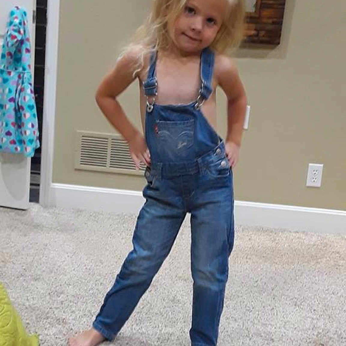 Holland is registered to the contest to win money with this photo: abdomen, blond, clothing, denim, jeans, leg, overall, person, textile, trousers, trunk, waist