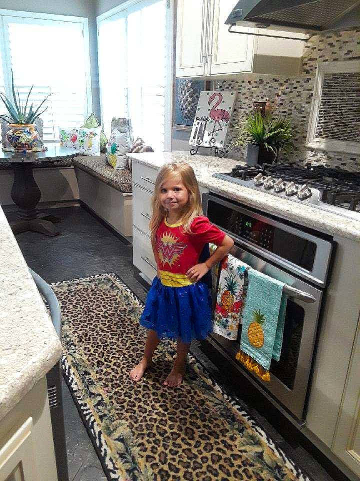 Holland is registered to the contest to win money with this photo: child, floor, flooring, house, joy, kitchen, person, room, toddler, vacation