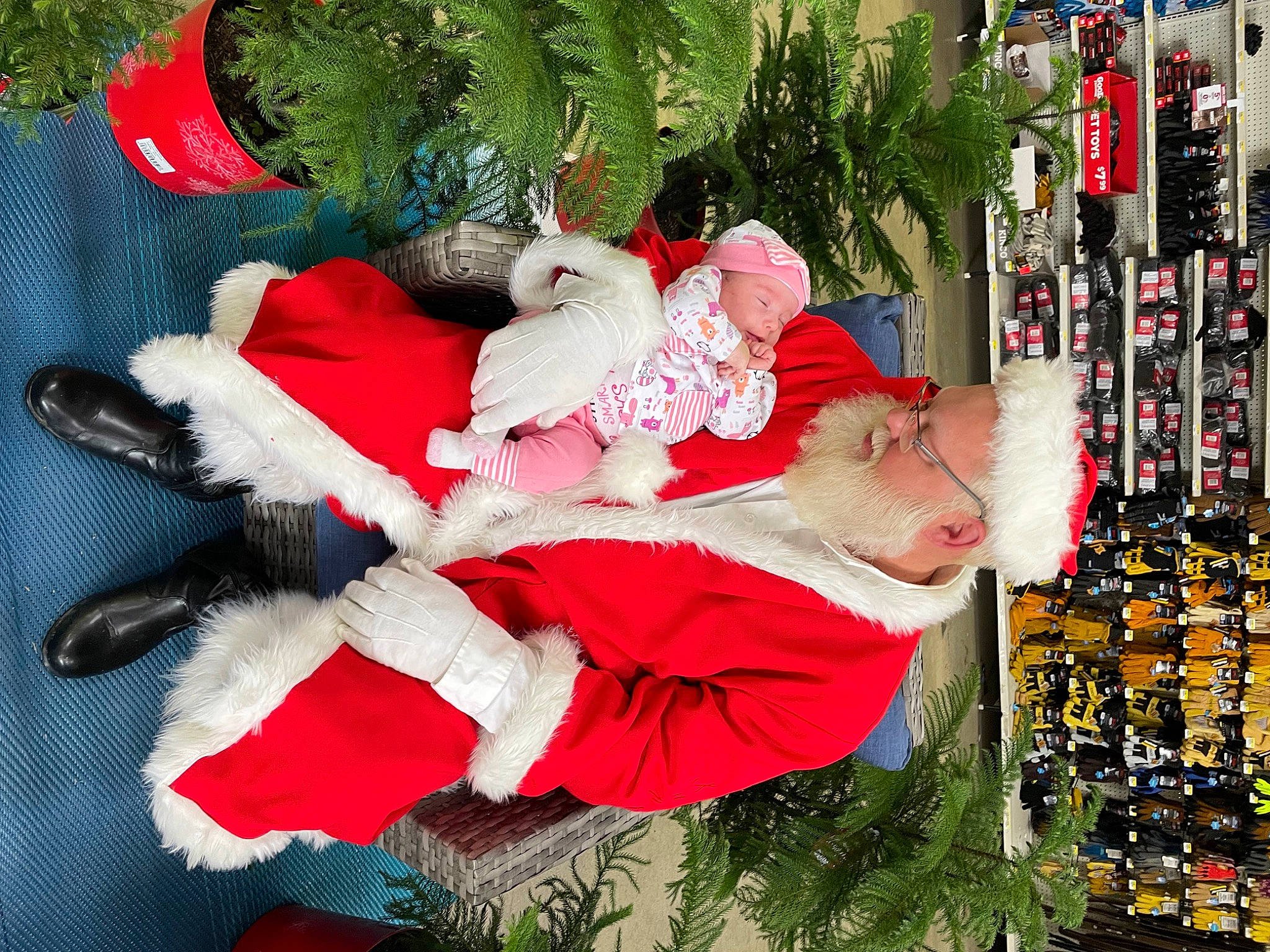 Paityn joined the competition — help win amazing prizes! carmine, christmas, christmas_decoration, christmas_eve, christmas_ornament, christmas_tree, event, fictional_character, green, head, headwear, holiday, holiday_ornament, human_body, lap, ornament, person, plant, red, santa_claus