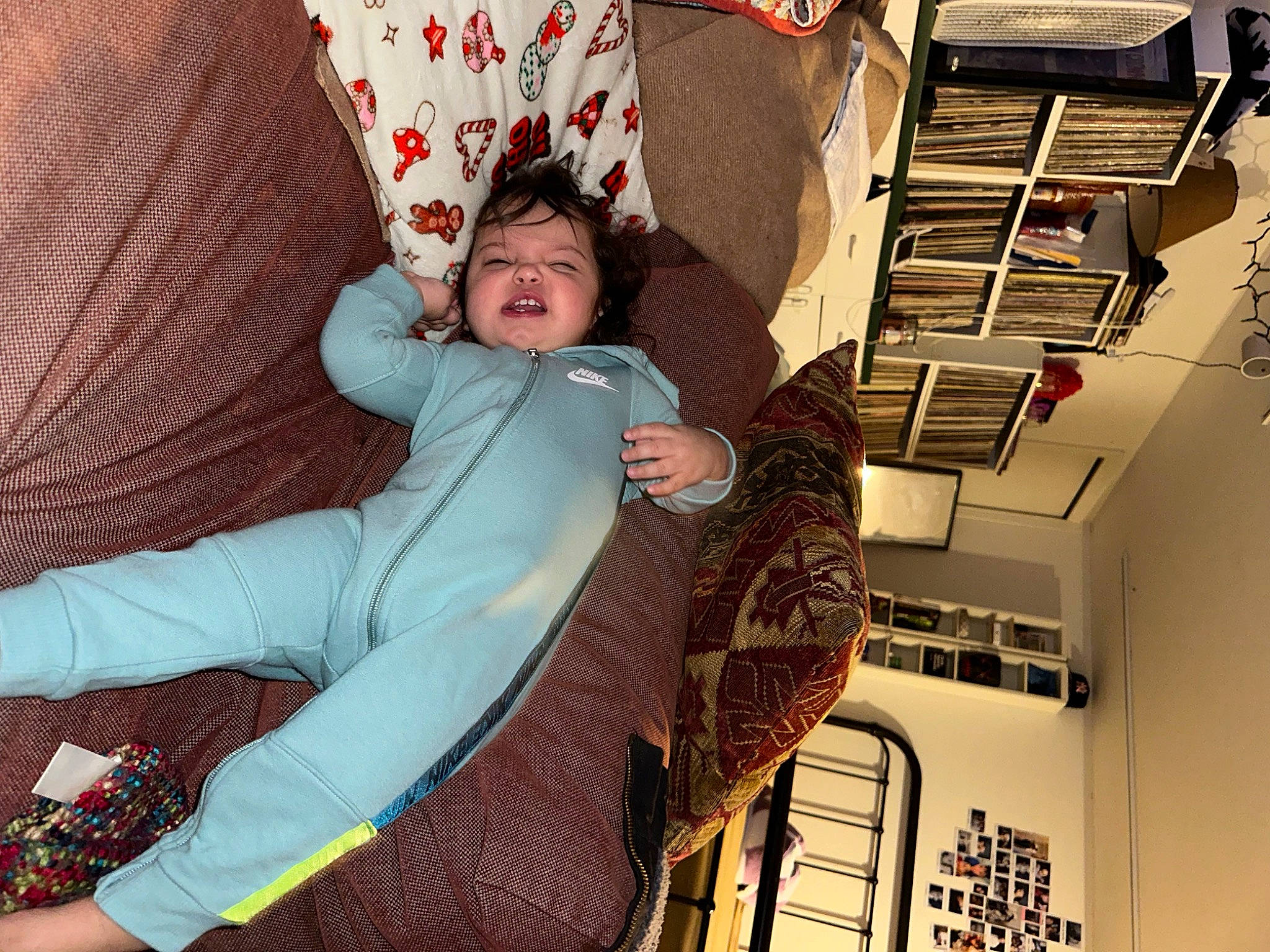 Amora is registered to the contest to win money with this photo: comfort, couch, fashion_design, flooring, fun, fur, happy, human_leg, lap, leisure, magenta, pattern, person, room, sitting, smile, thigh, toddler, visual_arts