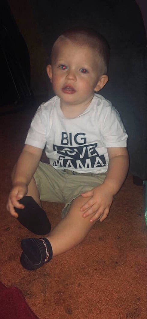 Ryland is registered to the contest to win money with this photo: baby_toddler_clothing, black, cheek, cool, elbow, face, finger, flash_photography, fun, gesture, happy, iris, mammal, mouth, nose, organ, person, skin, sleeve, standing