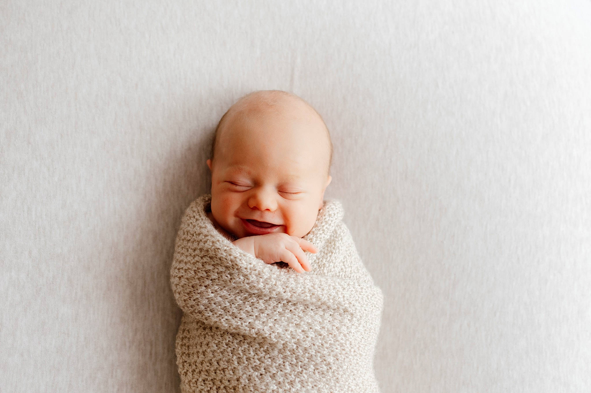 Kolby is registered to the contest to win money with this photo: art, baby, baby_sleeping, baby_toddler_clothing, cheek, child, comfort, ear, face, fashion_accessory, gesture, happy, headgear, person, sitting, sleeve, smile, thumb, toddler, wood