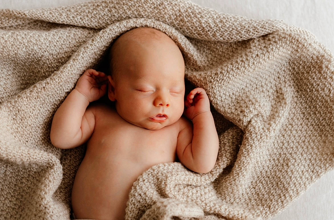 Kolby joined the competition — help win amazing prizes! baby, baby_sleeping, baby_toddler_clothing, bedding, cheek, child, chin, comfort, facial_expression, flesh, fur, happy, linens, mammal, pattern, person, portrait_photography, room, skin, textile