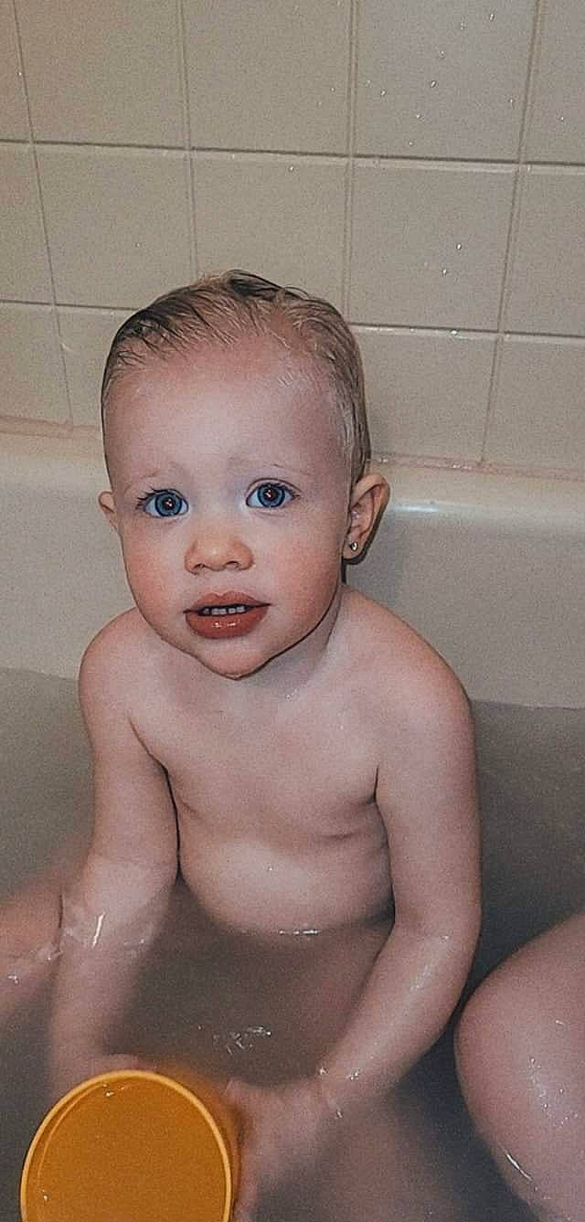Brynna is registered to the contest to win money with this photo: baby_bathing, bathing, bathroom, bathtub, cheek, chest, eye, eyebrow, face, fluid, hand, head, iris, lip, mouth, nose, person, plumbing, skin, toddler