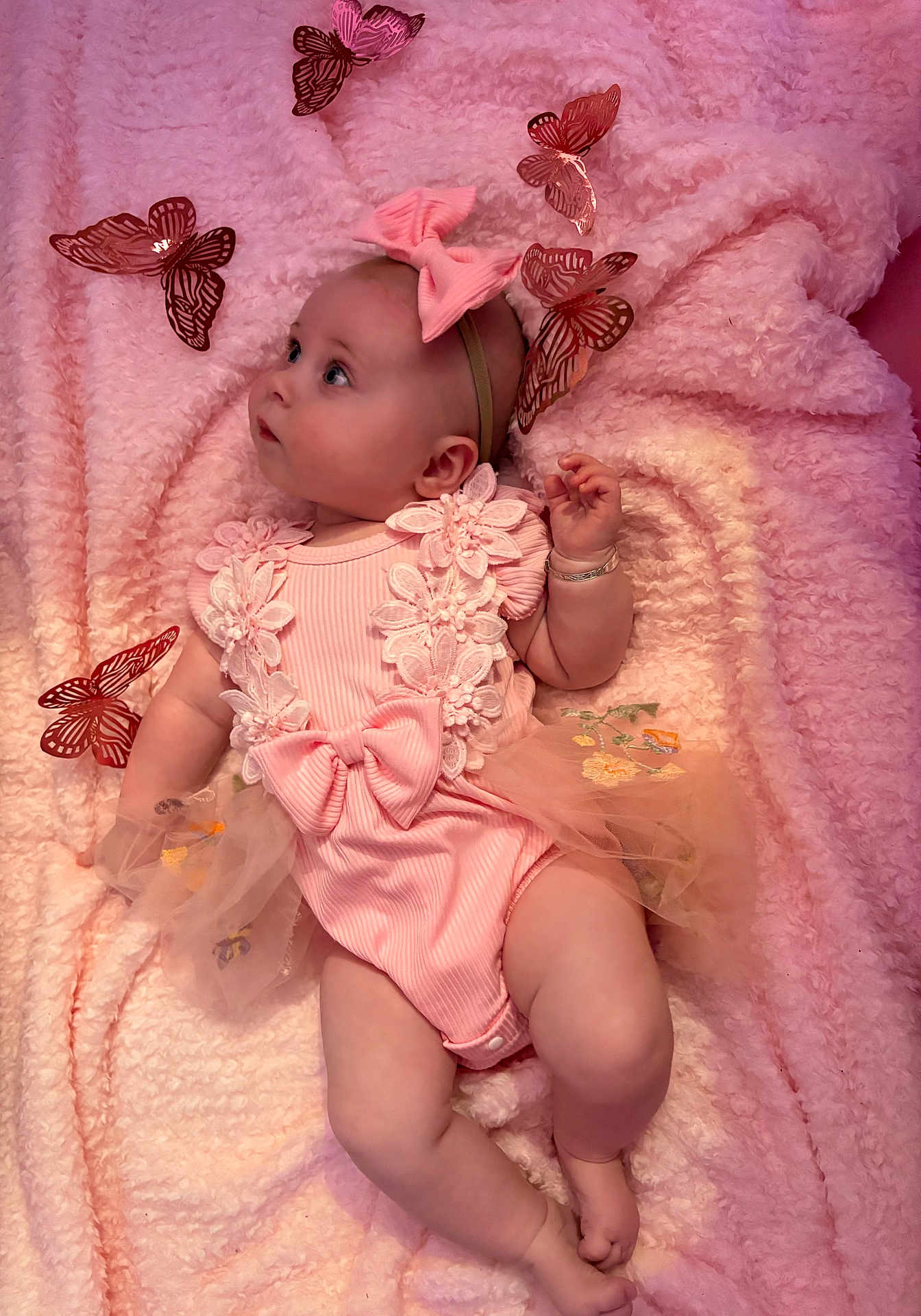 Tahleah joined the competition — help win amazing prizes! adorable, baby, blanket, bow, butterflies, child, cute, decorative, floral, headband, indoor, infant, looking_up, lying_down, pastel_colors, pink_clothing, portrait, small_person, soft_texture, tutu