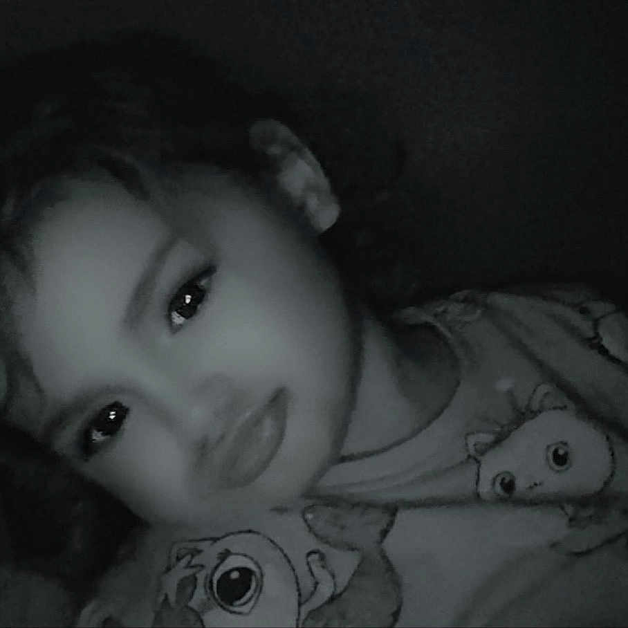 Mahelya participe au concours pour gagner de l'argent avec cette photo : child, face, pout, cartoon_clothing, dark, low_light, portrait, young, curly_hair, expression, indoors, tshirt, cute, filter_effect, eyes, head, person, closeup, smile, fun