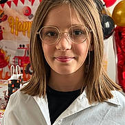 Lyliana a rejoint le concours — aidez-le/la à gagner de superbes lots ! child, glasses, smile, balloons, birthday_party, fire_truck, red, gold, black, white_shirt, young_person, portrait, indoor, celebration, face, decorations, casual_clothing, happy, person, event
