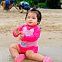 toddler, child, beach, sand, water, pink_clothing, happy, playing, outdoor, nature, smiling, feet, sitting, summer, casual, fun, young, people, kids, clapping